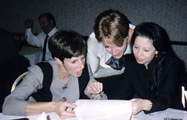 Hickey, Binari and Gallardo reading old copies of The Scroll