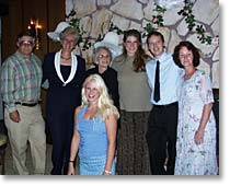 photo of the couple with bride's parents, grandmother, sister, new mother-in-law